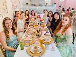 Bachelorette party enjoying a Dolly Parton themed tea party in Nashville, creating memorable moments with friendsPicture